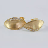 18K yellow gold Daphne laurel leaf diamond stud earrings with brushed matte finish.