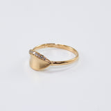 Diamond-lined laurel leaf ring in 14K yellow gold with organic brushed matte texture.