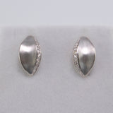 14K white gold Daphne laurel leaf diamond stud earrings with brushed matte finish.