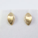 18K yellow gold Daphne laurel leaf diamond stud earrings with brushed matte finish, Handcrafted 14K yellow gold laurel leaf stud earrings with natural diamonds.